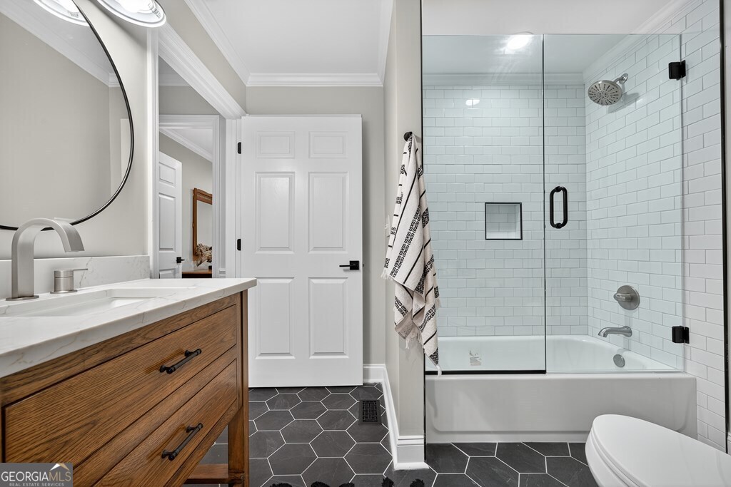 291 Power Point Milledgeville, GA 31061 - Photo 39 of 51 a bathroom with a double vanity sink toilet mirror and shower