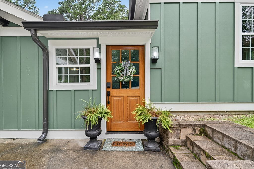 291 Power Point Milledgeville, GA 31061 - Photo 6 of 51 a view of front door of house with potted plants