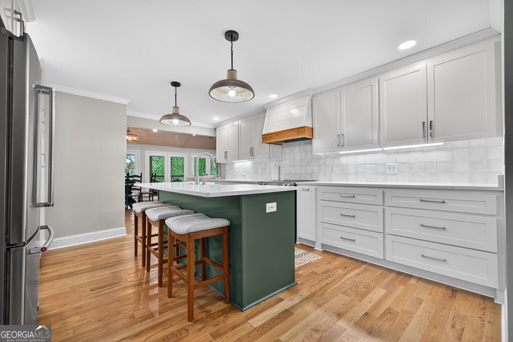291 Power Point Milledgeville, GA 31061 - Photo 8 of 51 a kitchen with cabinets and wooden floor