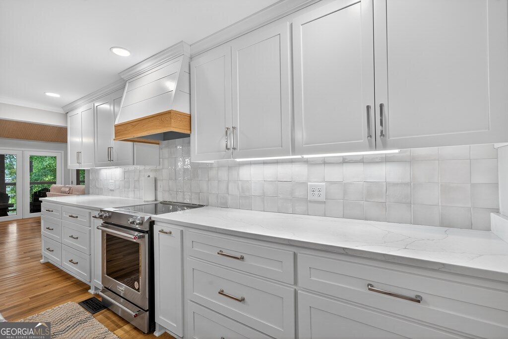291 Power Point Milledgeville, GA 31061 - Photo 10 of 51 a kitchen with stainless steel appliances white cabinets and a stove