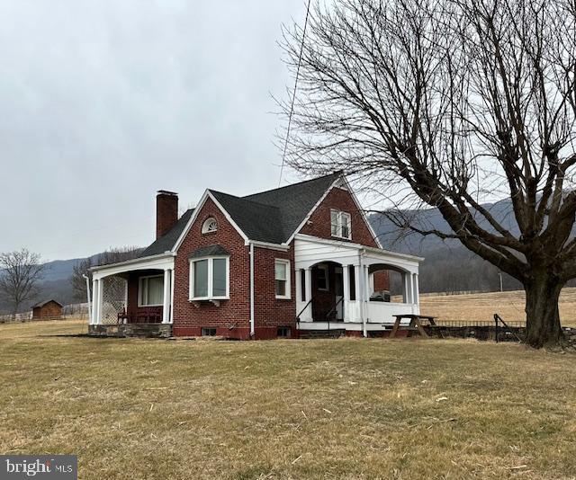 19642 Raystown Road James Creek, PA 16657 - Photo 1 of 38 a front view of a house with a garden