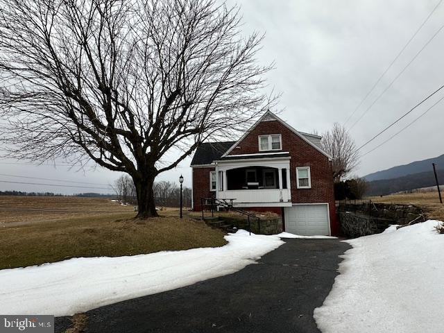 19642 Raystown Road James Creek, PA 16657 - Photo 2 of 38 a front view of a house with a yard covered with snow