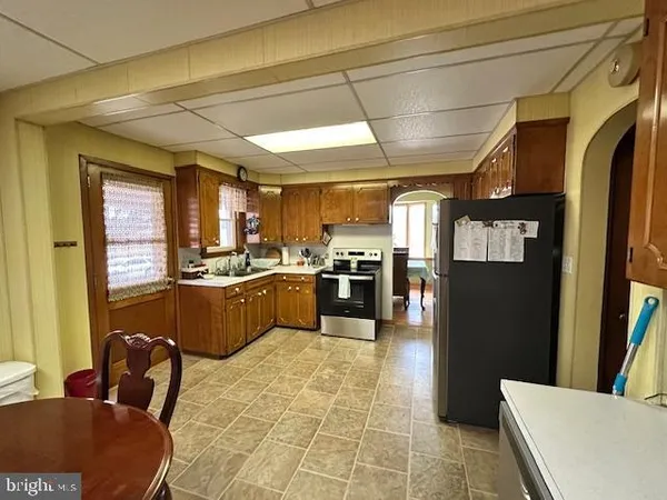 a kitchen with stainless steel appliances granite countertop a sink and cabinets