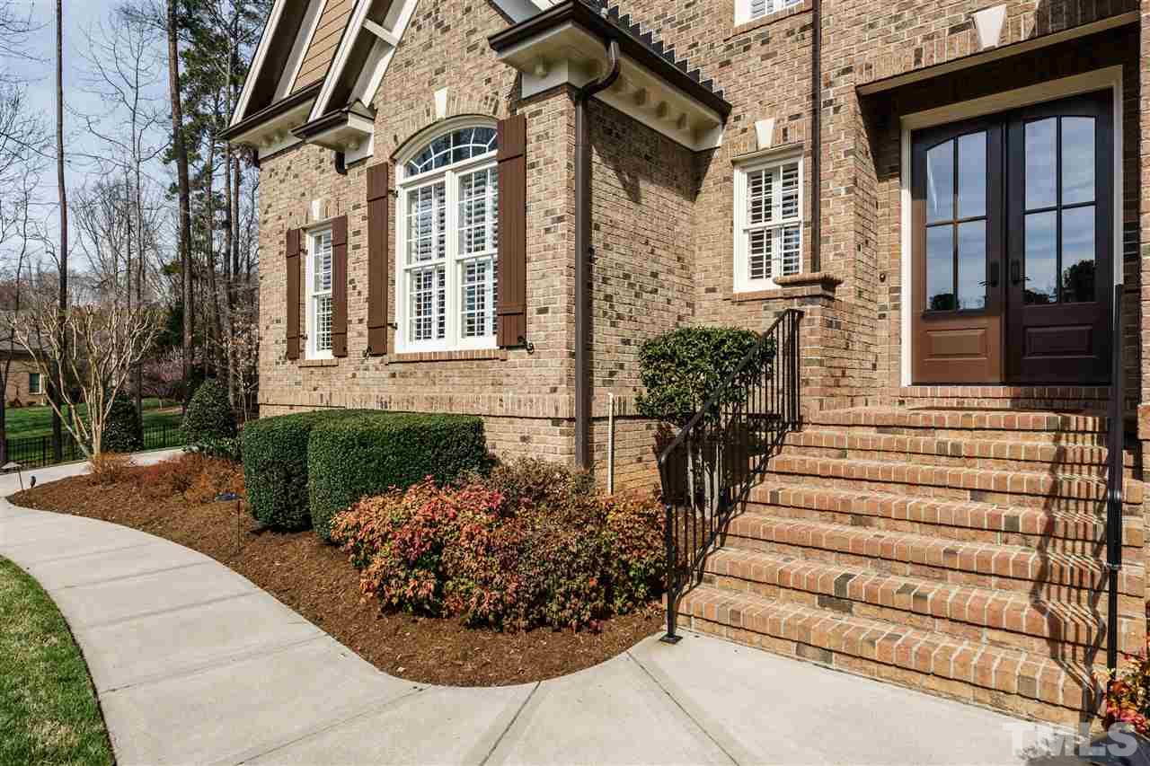 2000 Angelwing Court Raleigh, NC 27613 - Photo 2 of 25 a view of a house with more windows and flower plants