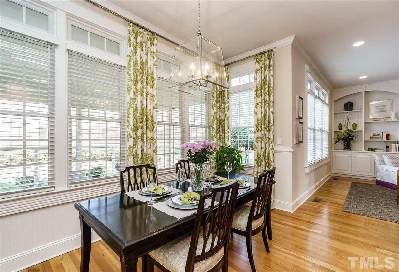2000 Angelwing Court Raleigh, NC 27613 - Photo 11 of 25 a dining room with furniture window wooden floor