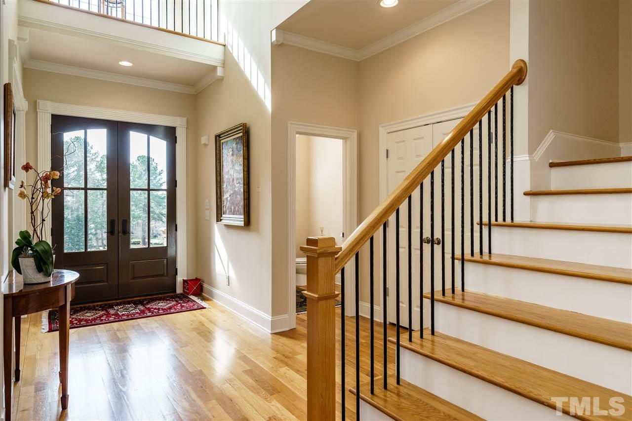 2000 Angelwing Court Raleigh, NC 27613 - Photo 3 of 25 a view of an entryway with wooden floor and door