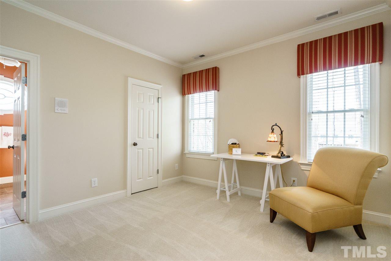2000 Angelwing Court Raleigh, NC 27613 - Photo 21 of 25 a living room with furniture a table and a window