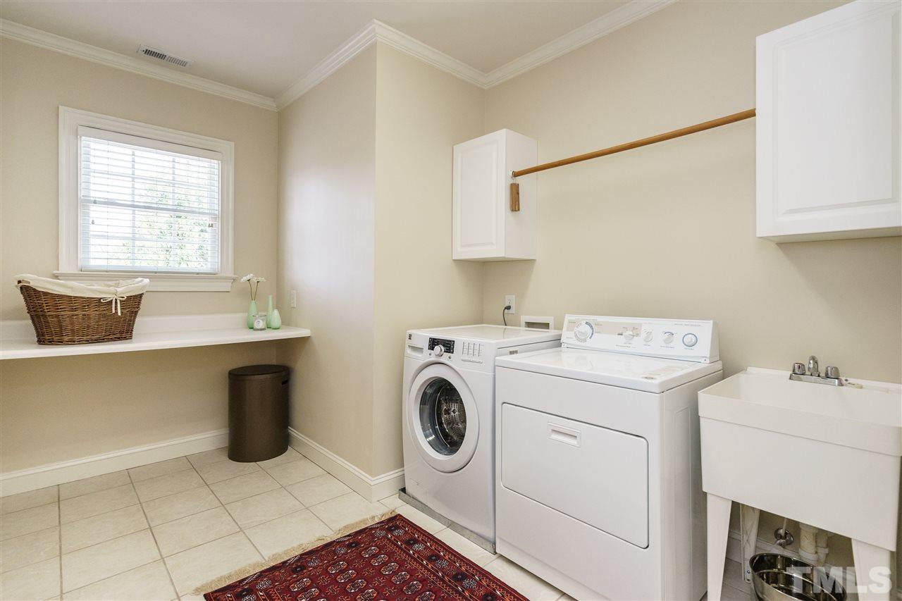 2000 Angelwing Court Raleigh, NC 27613 - Photo 22 of 25 a utility room with dryer and washer