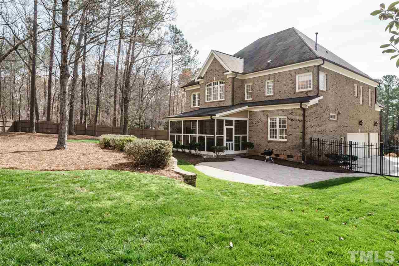 2000 Angelwing Court Raleigh, NC 27613 - Photo 25 of 25 a backyard of a house with table and chairs