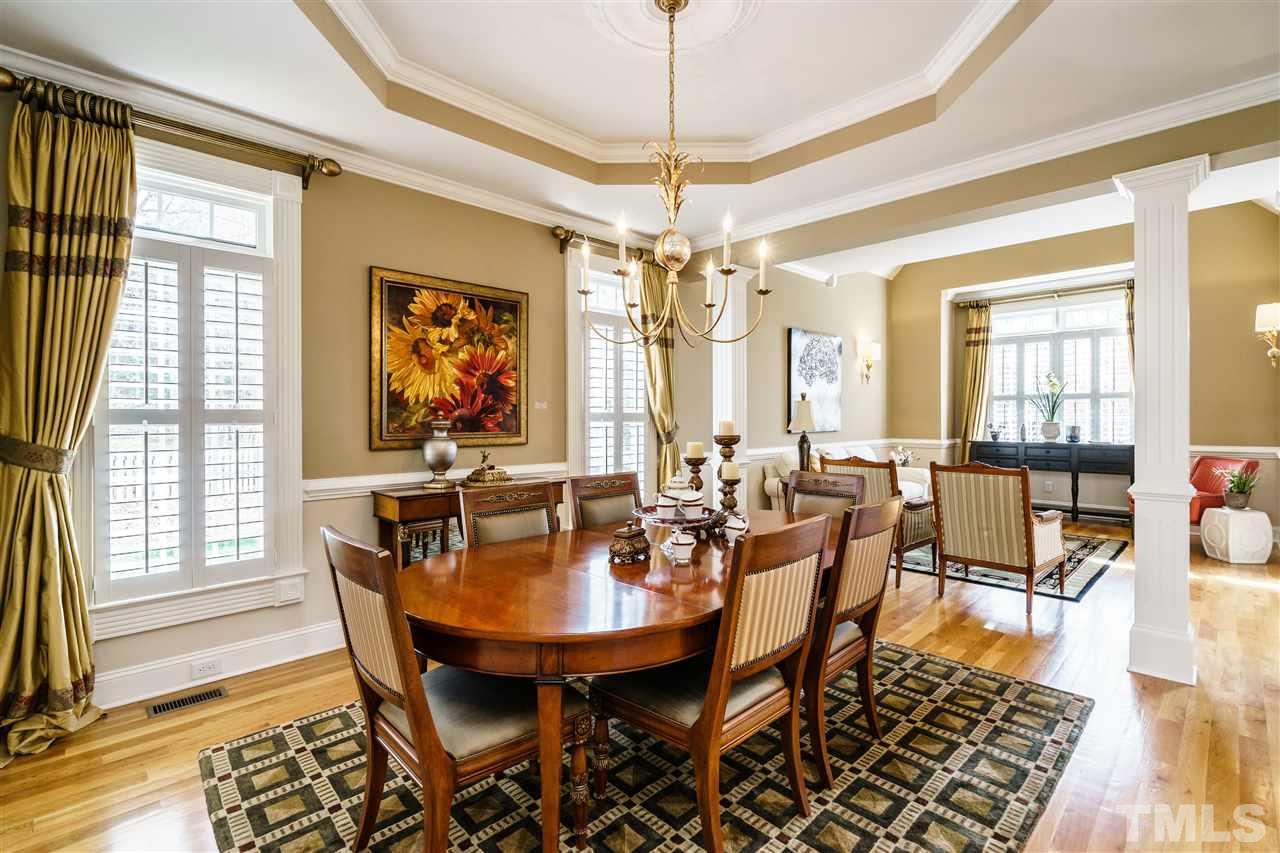2000 Angelwing Court Raleigh, NC 27613 - Photo 7 of 25 a view of a dining room with furniture window and wooden floor
