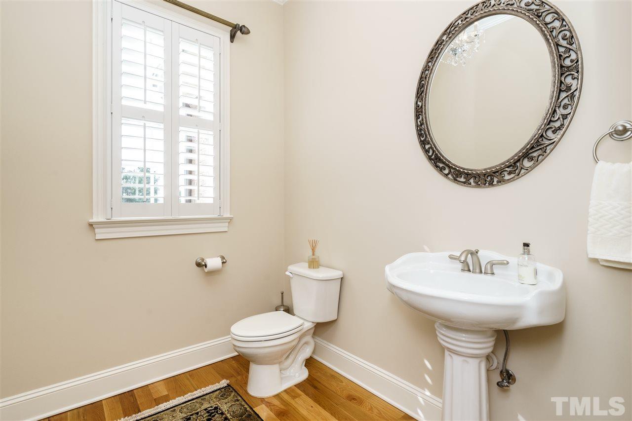 2000 Angelwing Court Raleigh, NC 27613 - Photo 8 of 25 a bathroom with a sink and a mirror