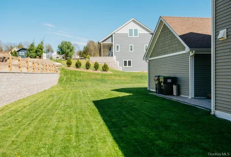 a front view of a house with a yard and porch