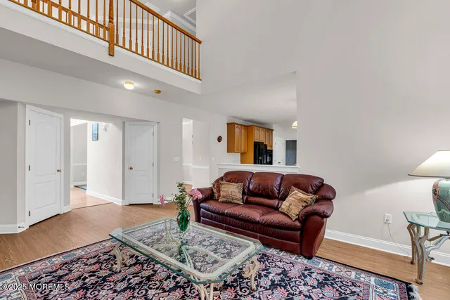 a living room with furniture and a rug