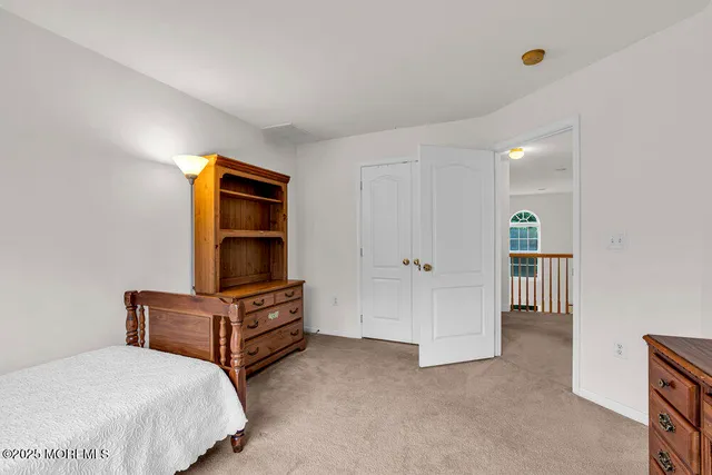 a bedroom with furniture and window