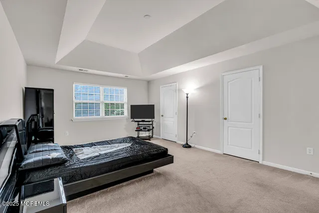 a bedroom with furniture and a window