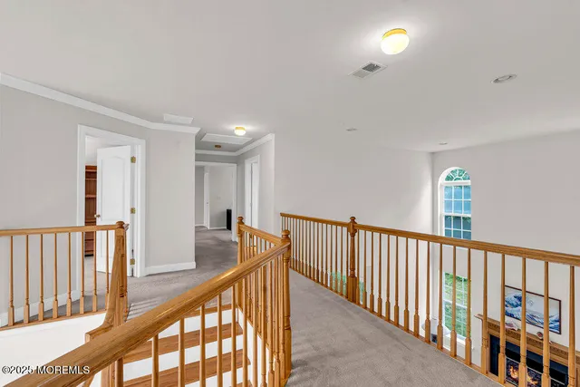 a view of a hallway with closet area