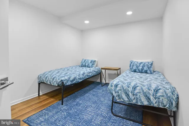 a bedroom with a bed and a chair