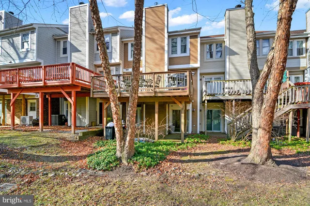 front view of a brick house with a yard