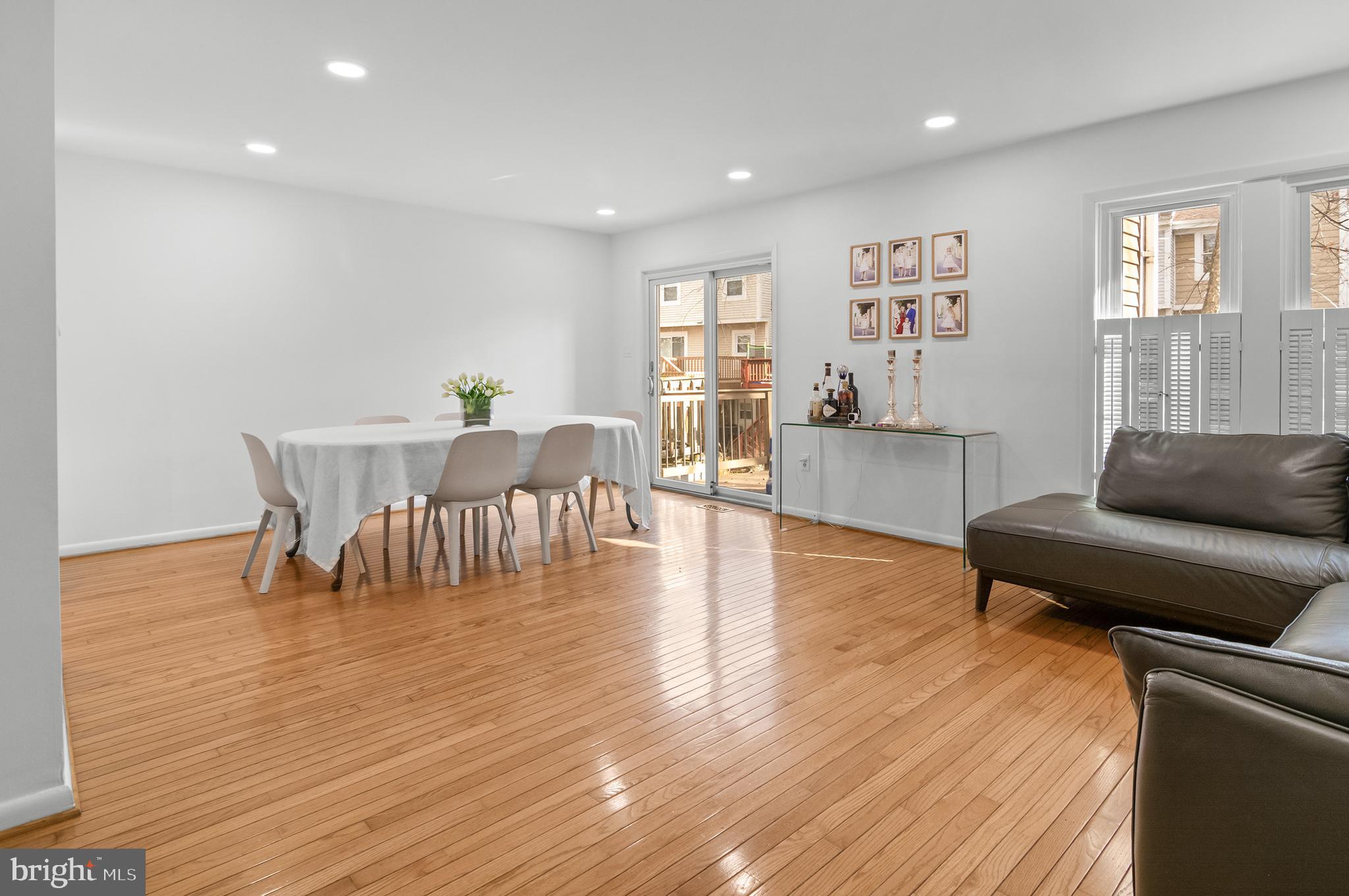 6939 Copper Bend Lane Baltimore, MD 21209 - Photo 3 of 18 a living room with furniture and wooden floor