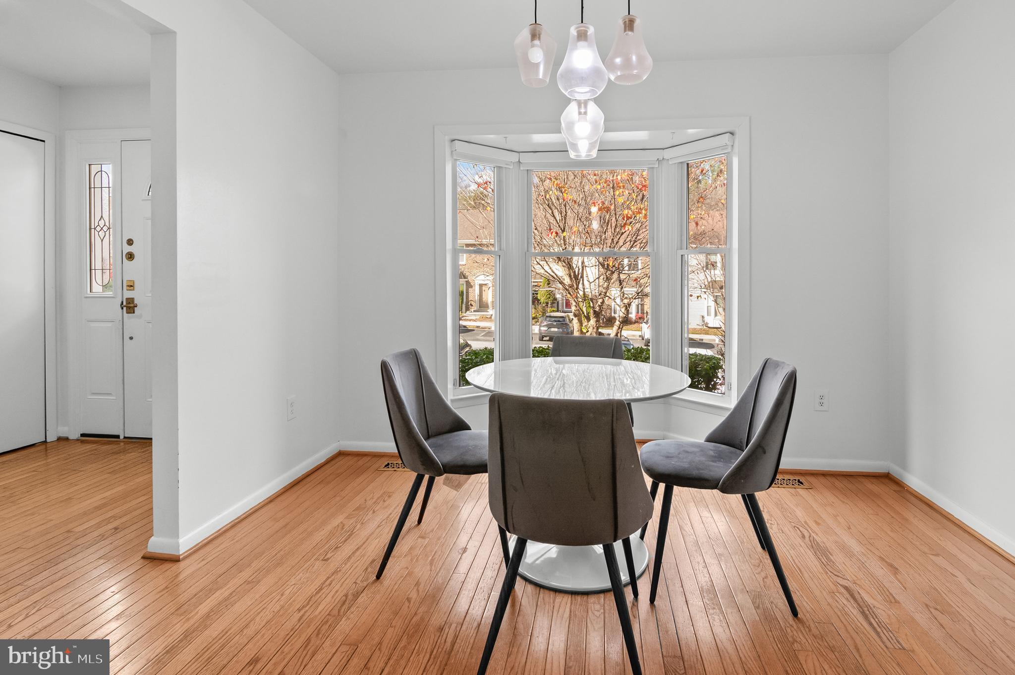 6939 Copper Bend Lane Baltimore, MD 21209 - Photo 7 of 18 a view of a dining room with furniture window and wooden floor
