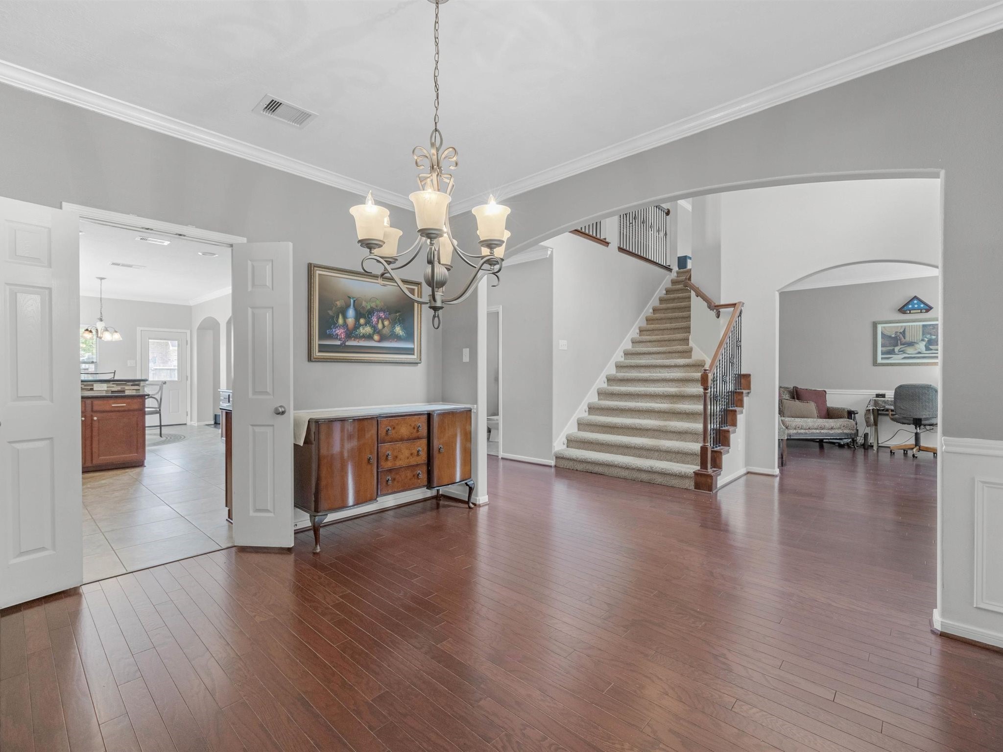 3310 Compass Court Conroe, TX 77301 - Photo 17 of 38 a view of a livingroom with wooden floor and stairs