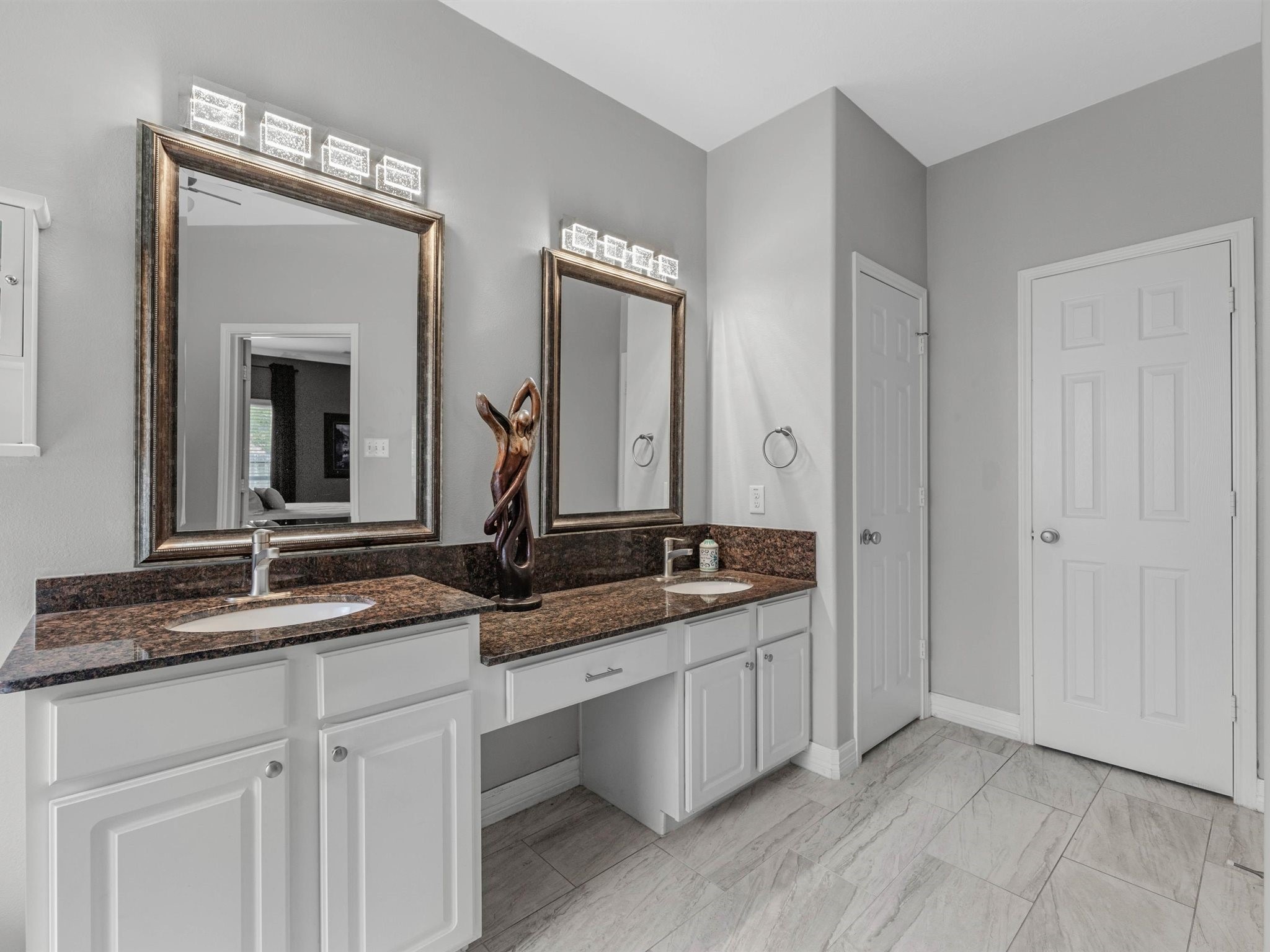 3310 Compass Court Conroe, TX 77301 - Photo 21 of 38 a bathroom with a granite countertop sink and a mirror
