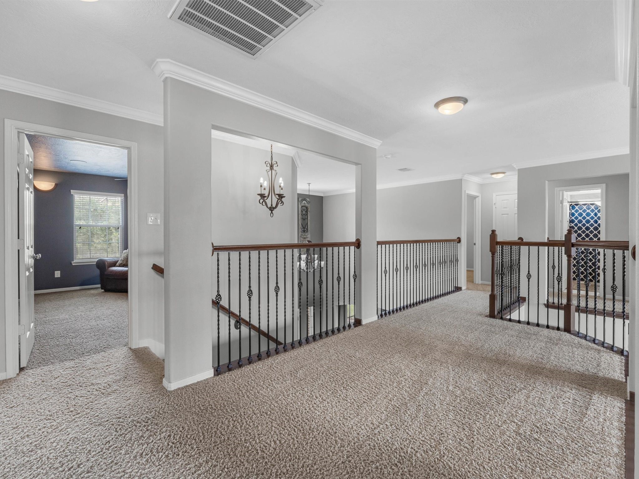 3310 Compass Court Conroe, TX 77301 - Photo 24 of 38 a view of a hallway with wooden floor and windows