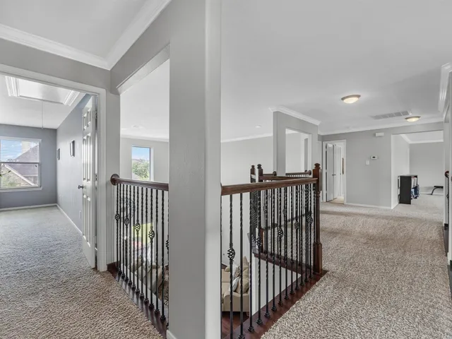 a view of a hallway with windows