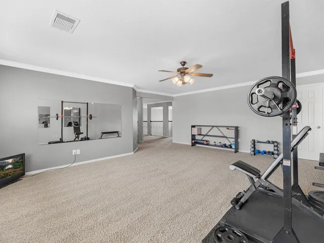 a view of a livingroom with furniture and a chandelier