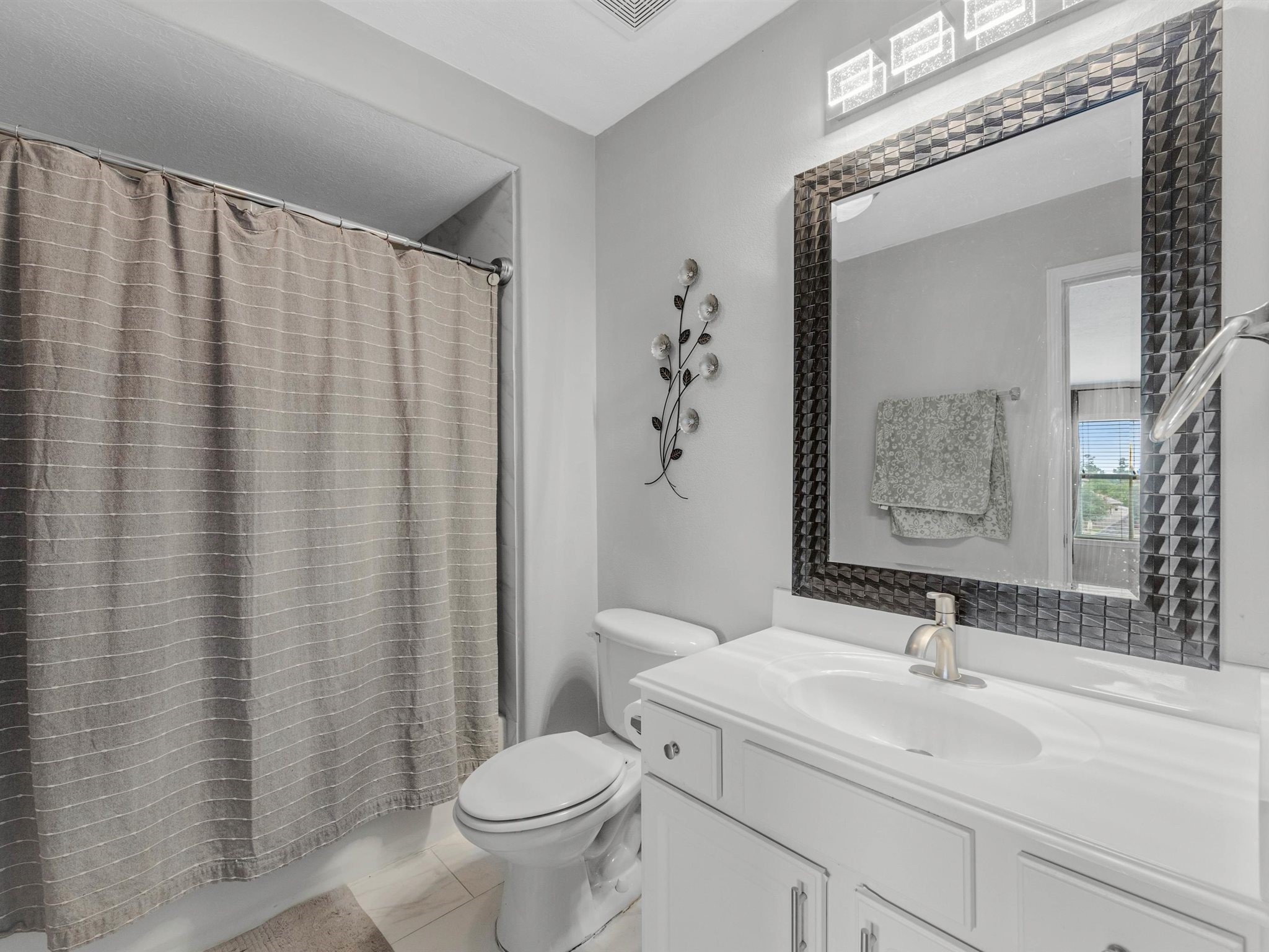 3310 Compass Court Conroe, TX 77301 - Photo 32 of 38 a bathroom with a sink and a mirror