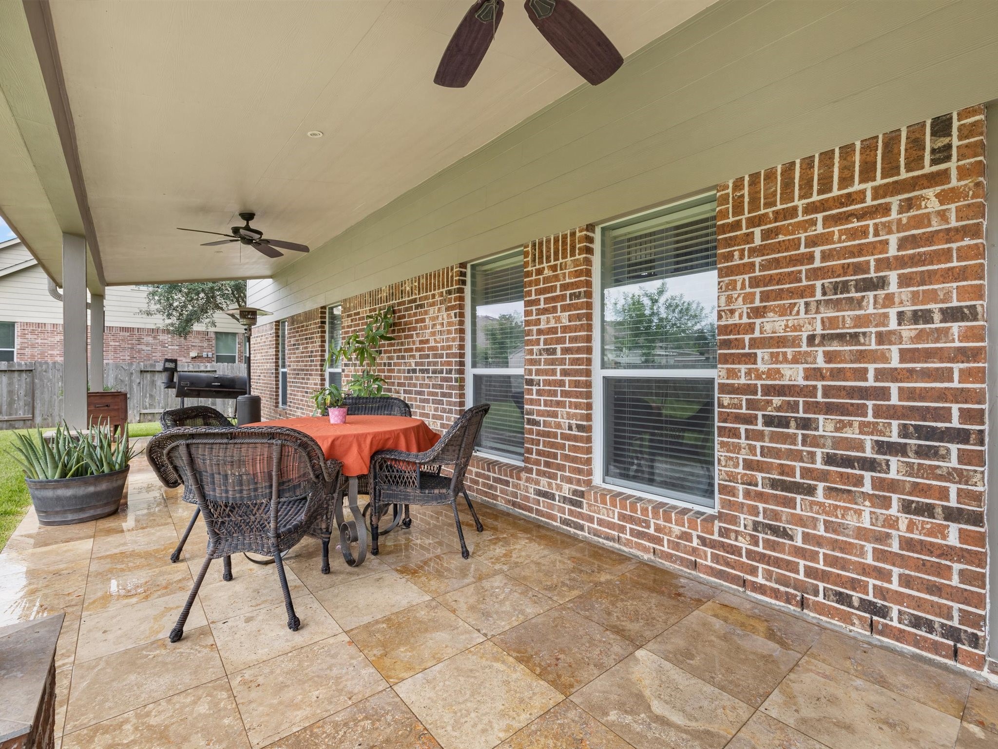 3310 Compass Court Conroe, TX 77301 - Photo 38 of 38 a view of a patio with a table and chairs