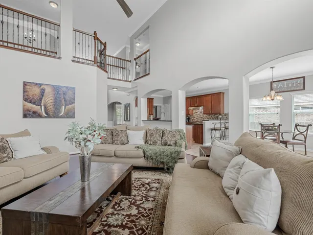 a living room with furniture fireplace and a view of living room