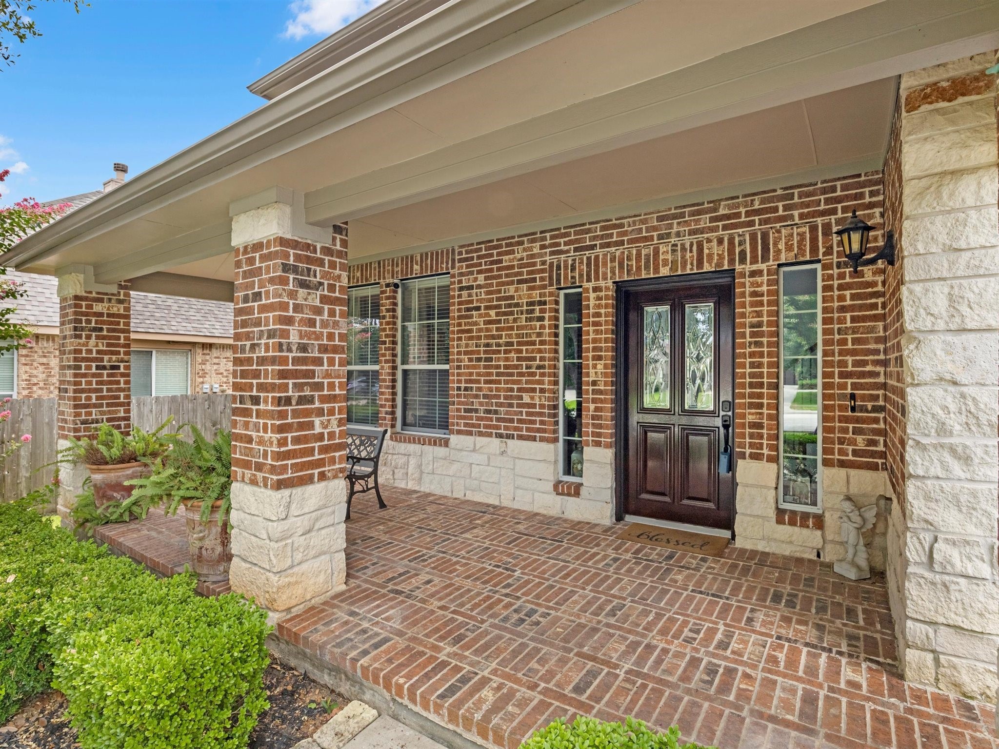 3310 Compass Court Conroe, TX 77301 - Photo 7 of 38 a front view of a house with outdoor seating and plants