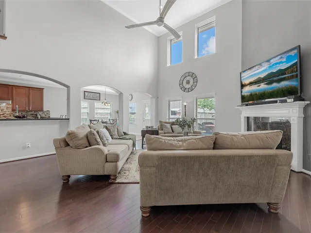 a living room with fireplace furniture and a flat screen tv