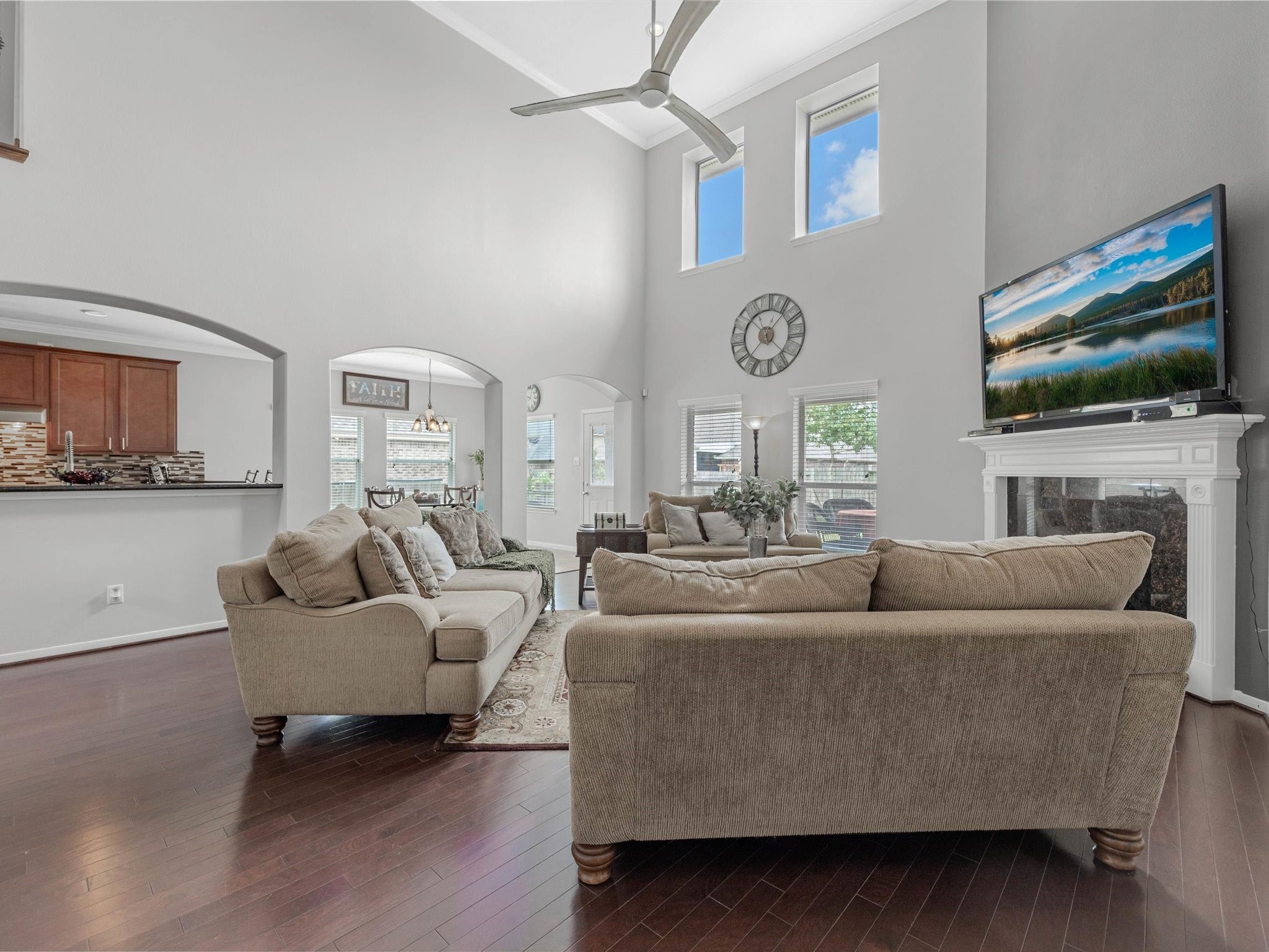 3310 Compass Court Conroe, TX 77301 - Photo 10 of 38 a living room with fireplace furniture and a flat screen tv