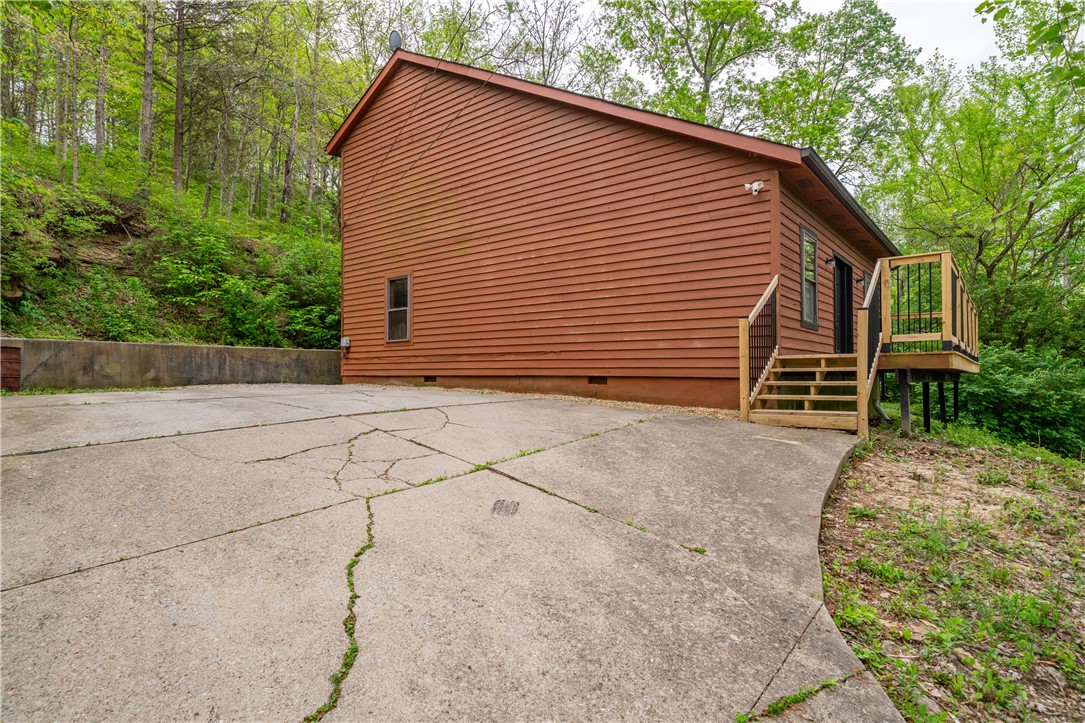 10584 New Biddinger Road Harrison, OH 45030 - Photo 38 of 61 This charming retreat is nestled amidst lush greenery, offering a serene escape.