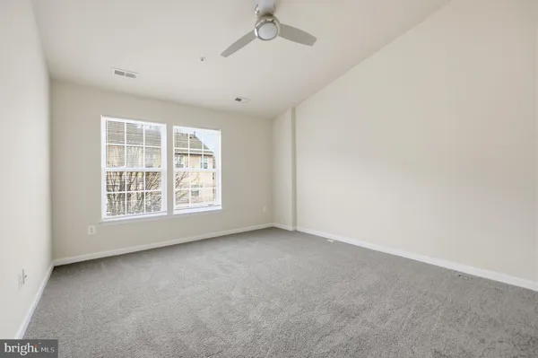 a bedroom with bed and a flat screen tv
