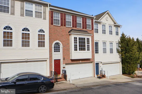 a view of a car park in front of a house