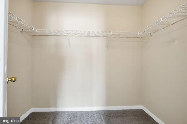 a bathroom with a tub sink shower and mirror