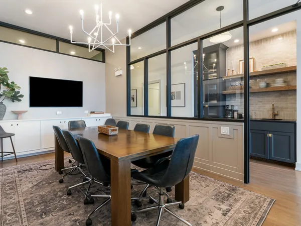 a view of a dining room with furniture window and wooden floor