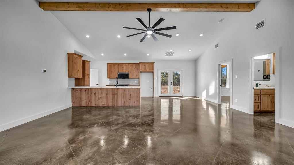 2501 Cowley Road Perrin, TX 76486 - Photo 2 of 31 Open concept with stained concrete floors!