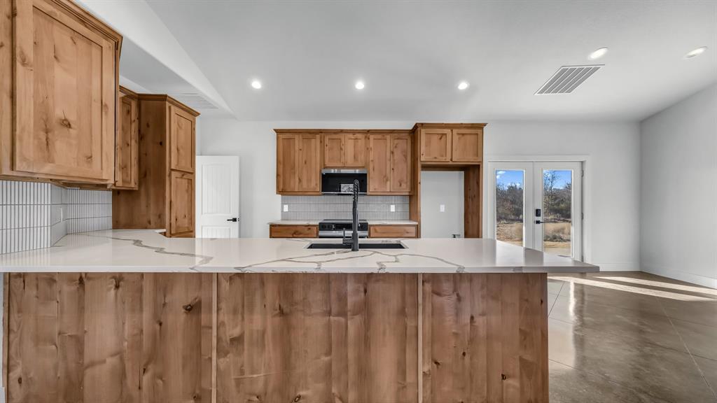2501 Cowley Road Perrin, TX 76486 - Photo 3 of 31 Large kitchen island! Perfect for entertaining!