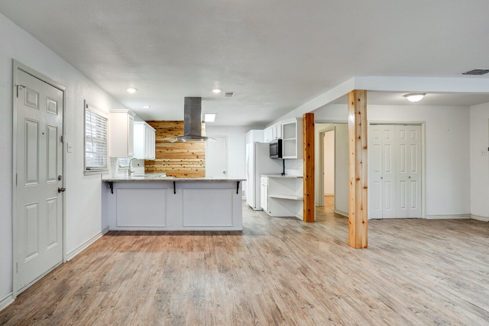 2826 54th Street Lubbock, TX 79413 - Photo 11 of 32 a view of kitchen with stainless steel appliances kitchen island wooden floors and view living room