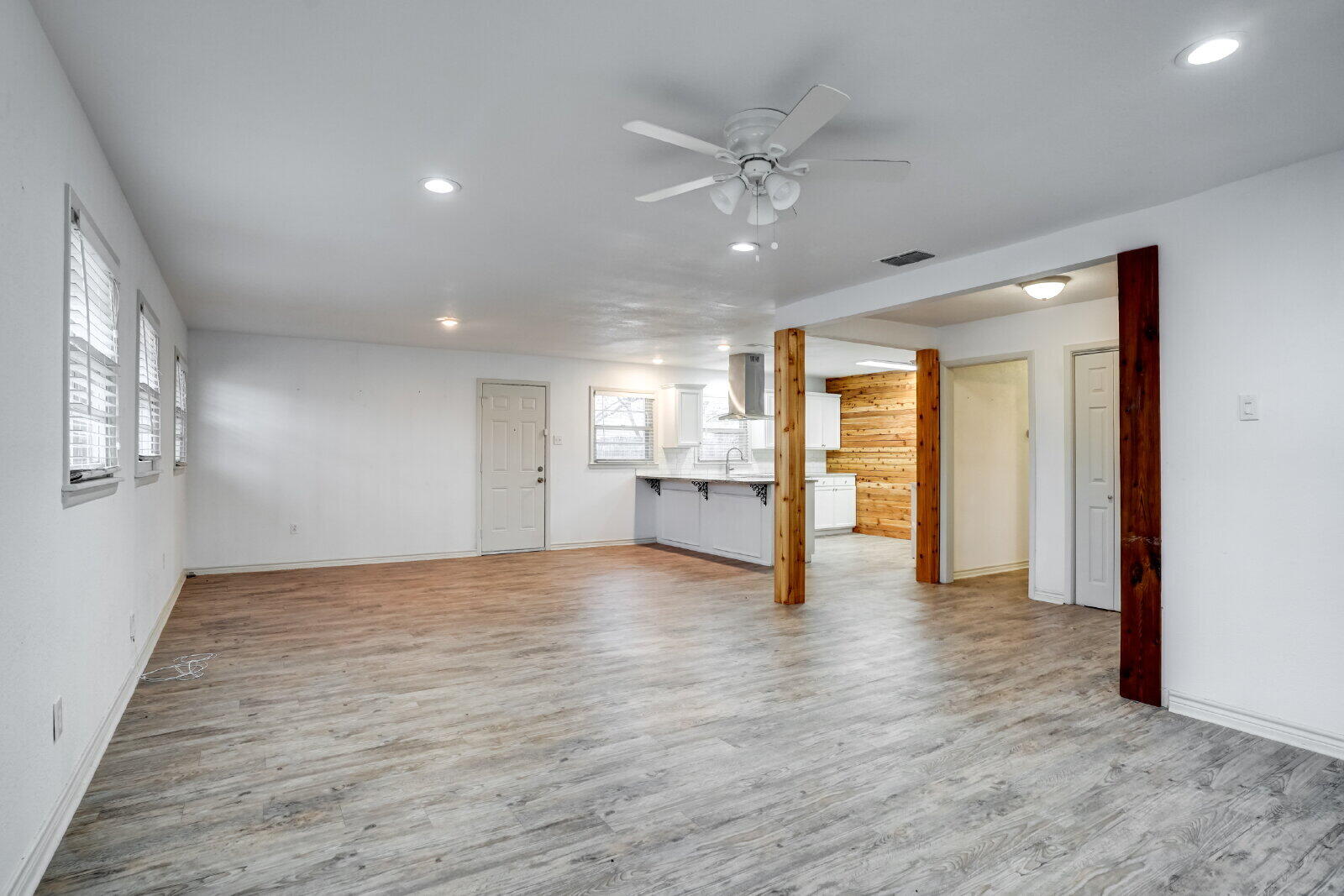 2826 54th Street Lubbock, TX 79413 - Photo 12 of 32 a view of an empty room with window and wooden floor