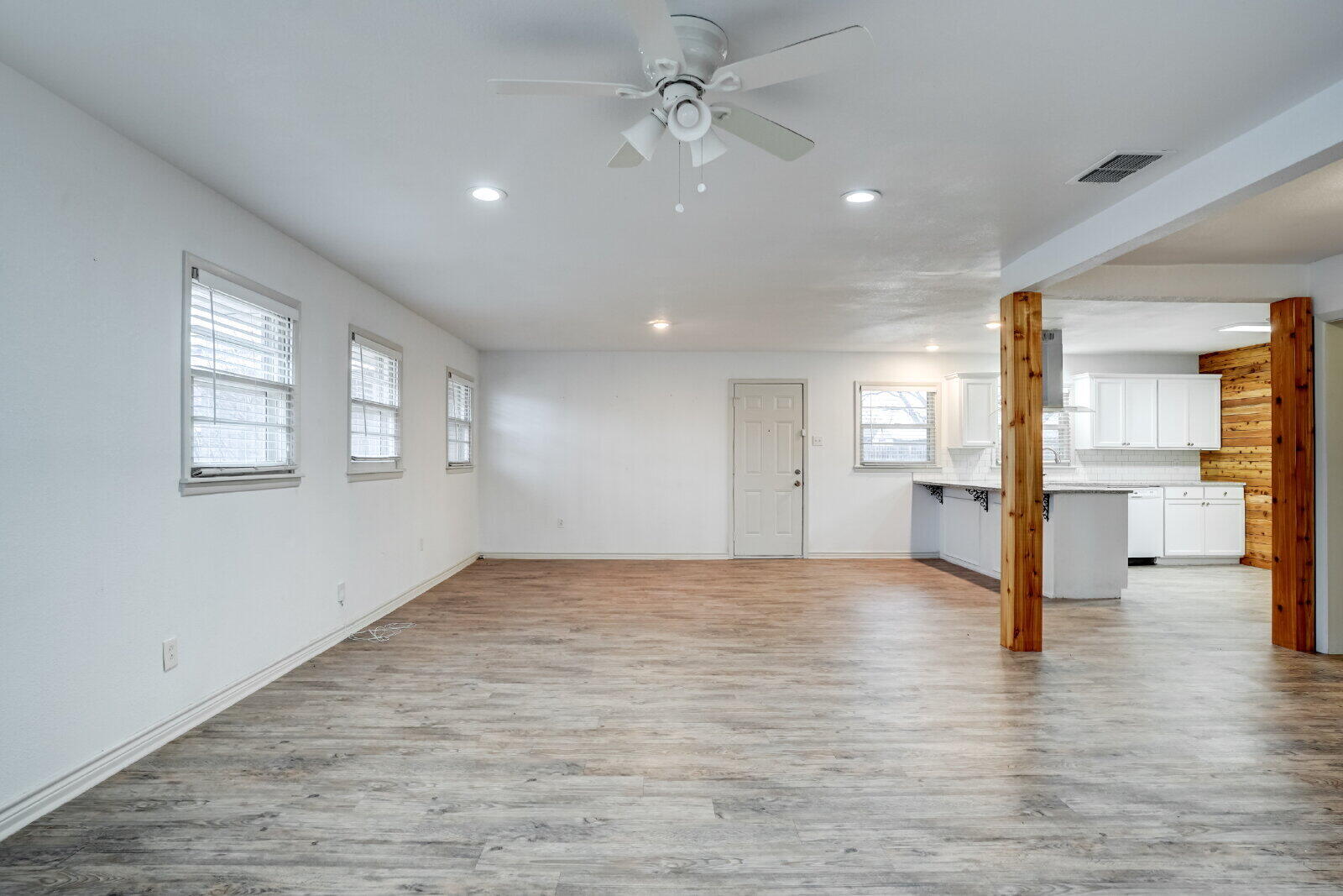 2826 54th Street Lubbock, TX 79413 - Photo 13 of 32 a view of empty room with wooden floor and a ceiling fan