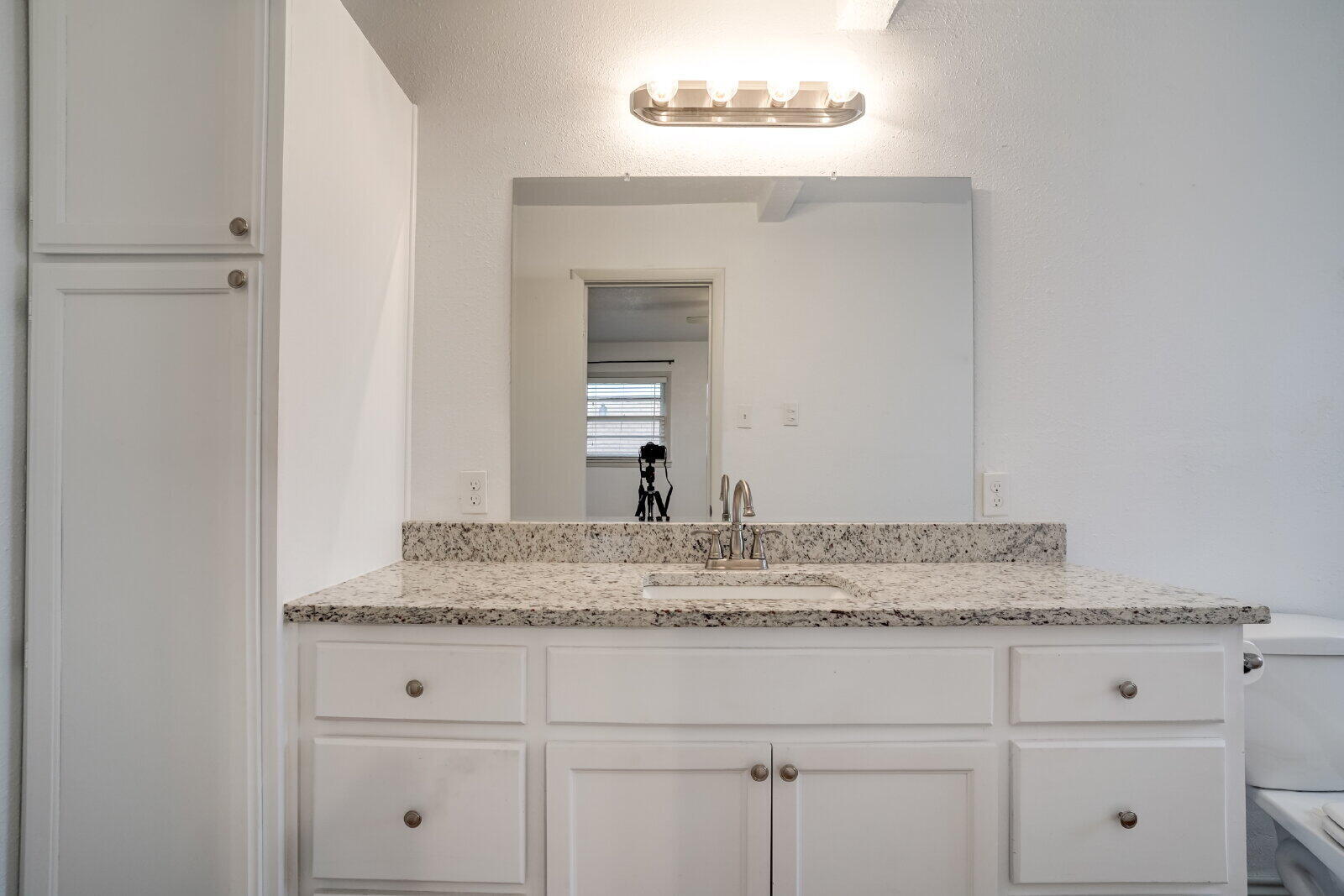 2826 54th Street Lubbock, TX 79413 - Photo 16 of 32 a bathroom with a sink and vanity