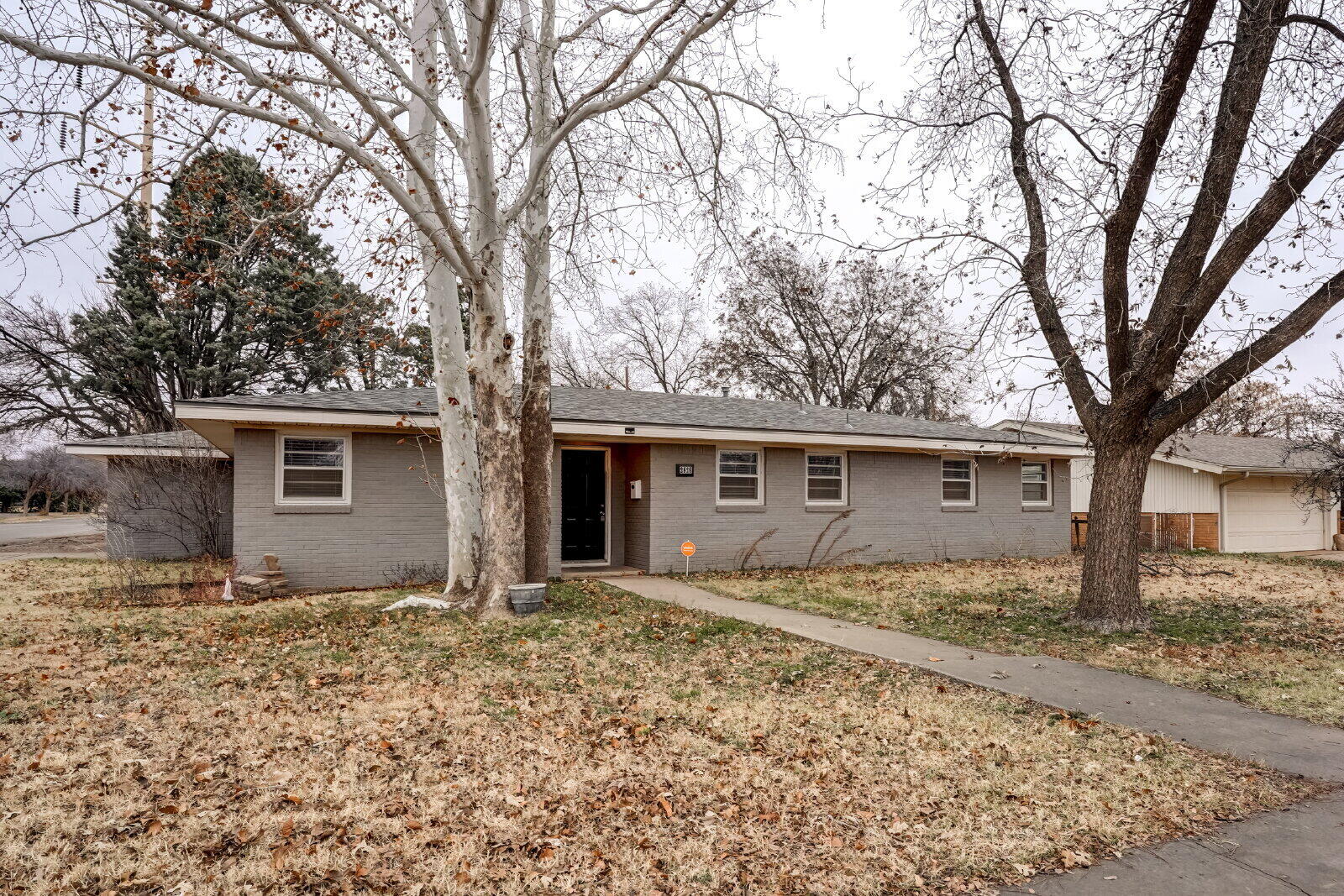 2826 54th Street Lubbock, TX 79413 - Photo 2 of 32 front view of a house with a yard
