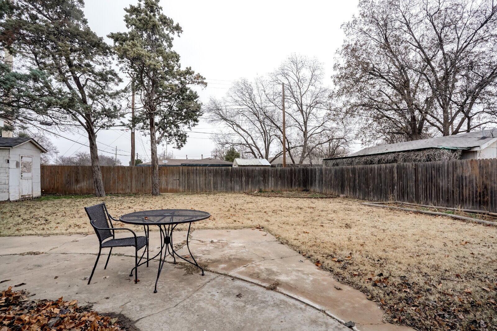 2826 54th Street Lubbock, TX 79413 - Photo 30 of 32 a backyard of a house with table and chairs