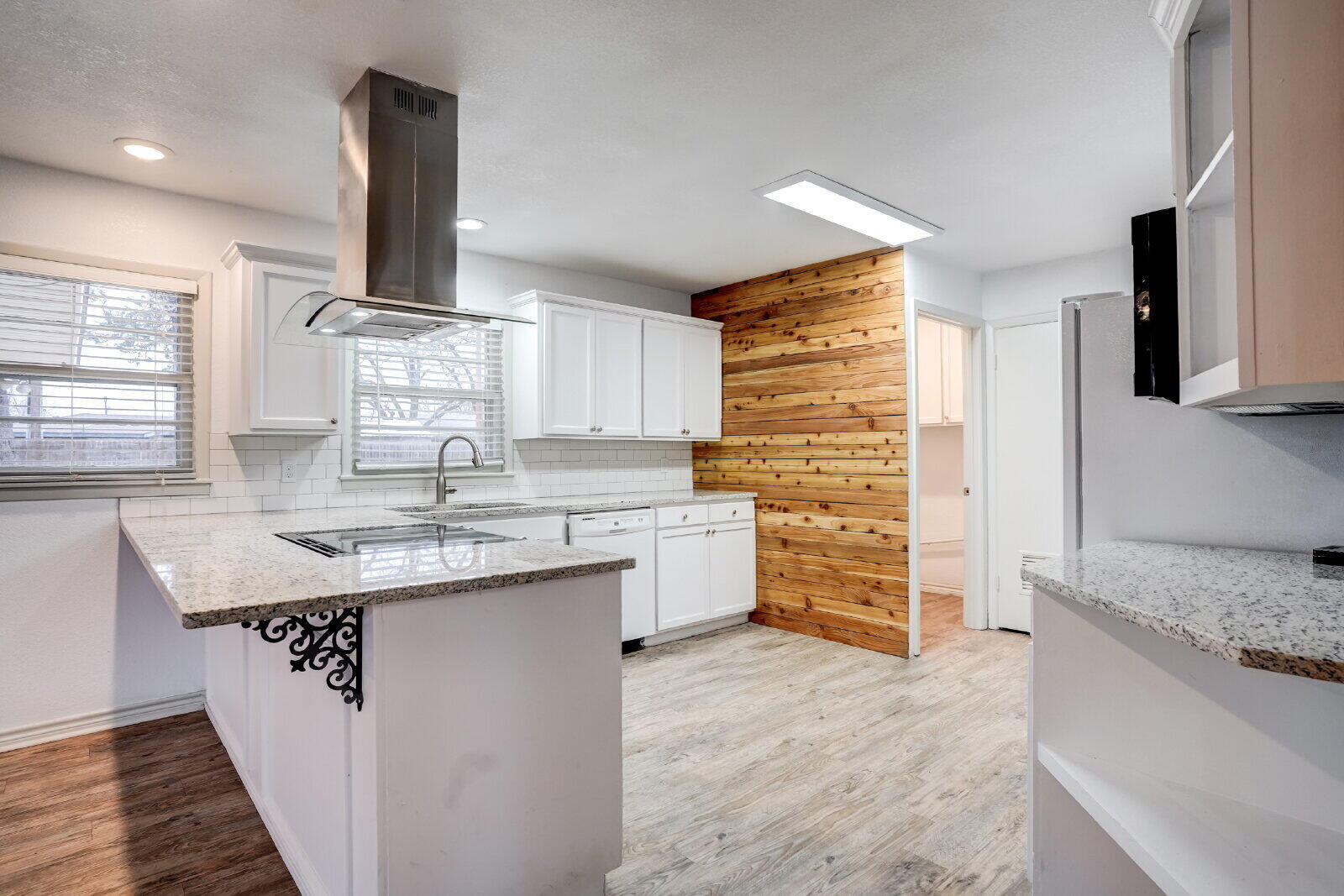 2826 54th Street Lubbock, TX 79413 - Photo 5 of 32 a kitchen with stainless steel appliances granite countertop a sink and a stove