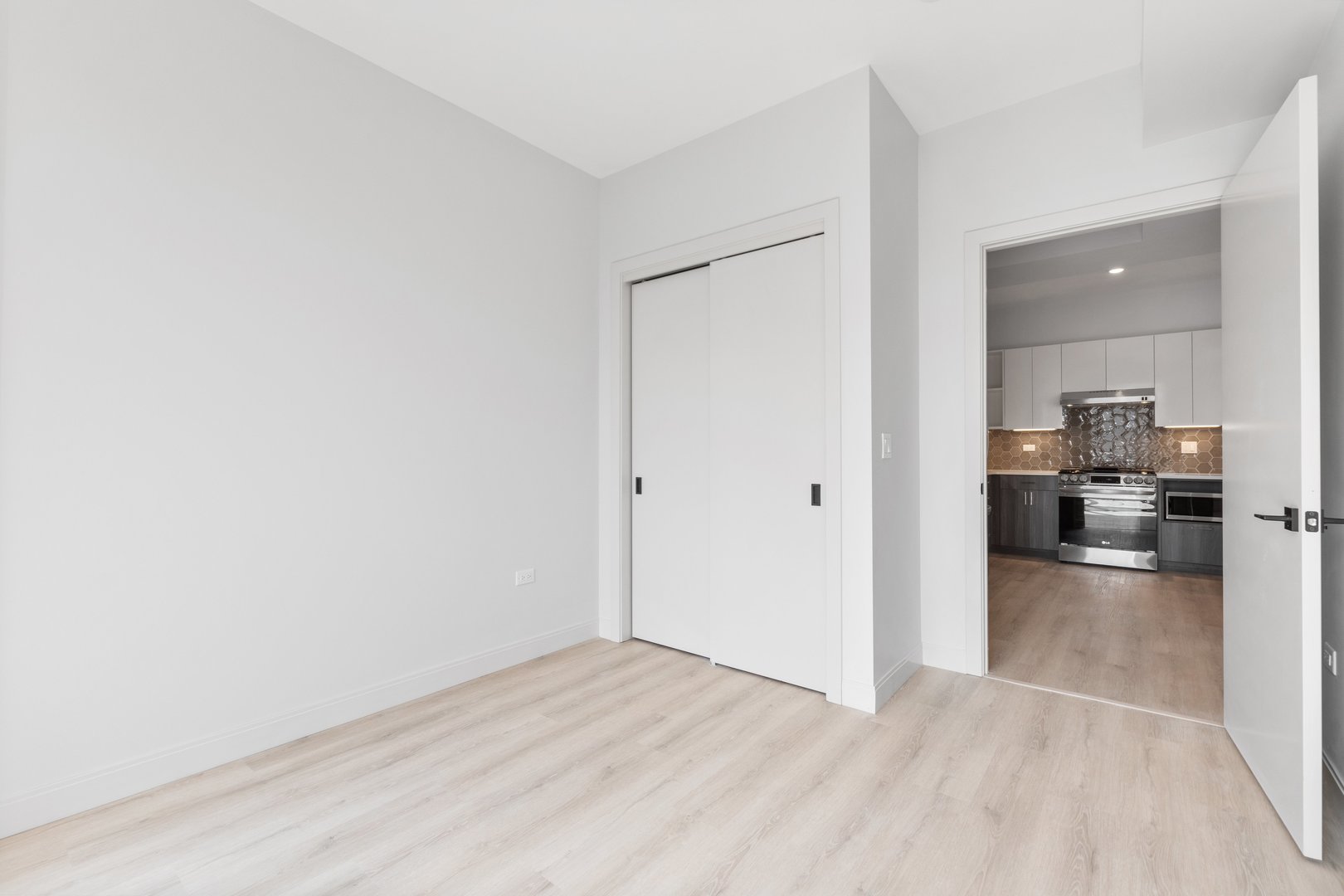 Undisclosed Address Chicago, IL 60640 - Photo 16 of 35 a view of a kitchen cabinets and a wooden floor